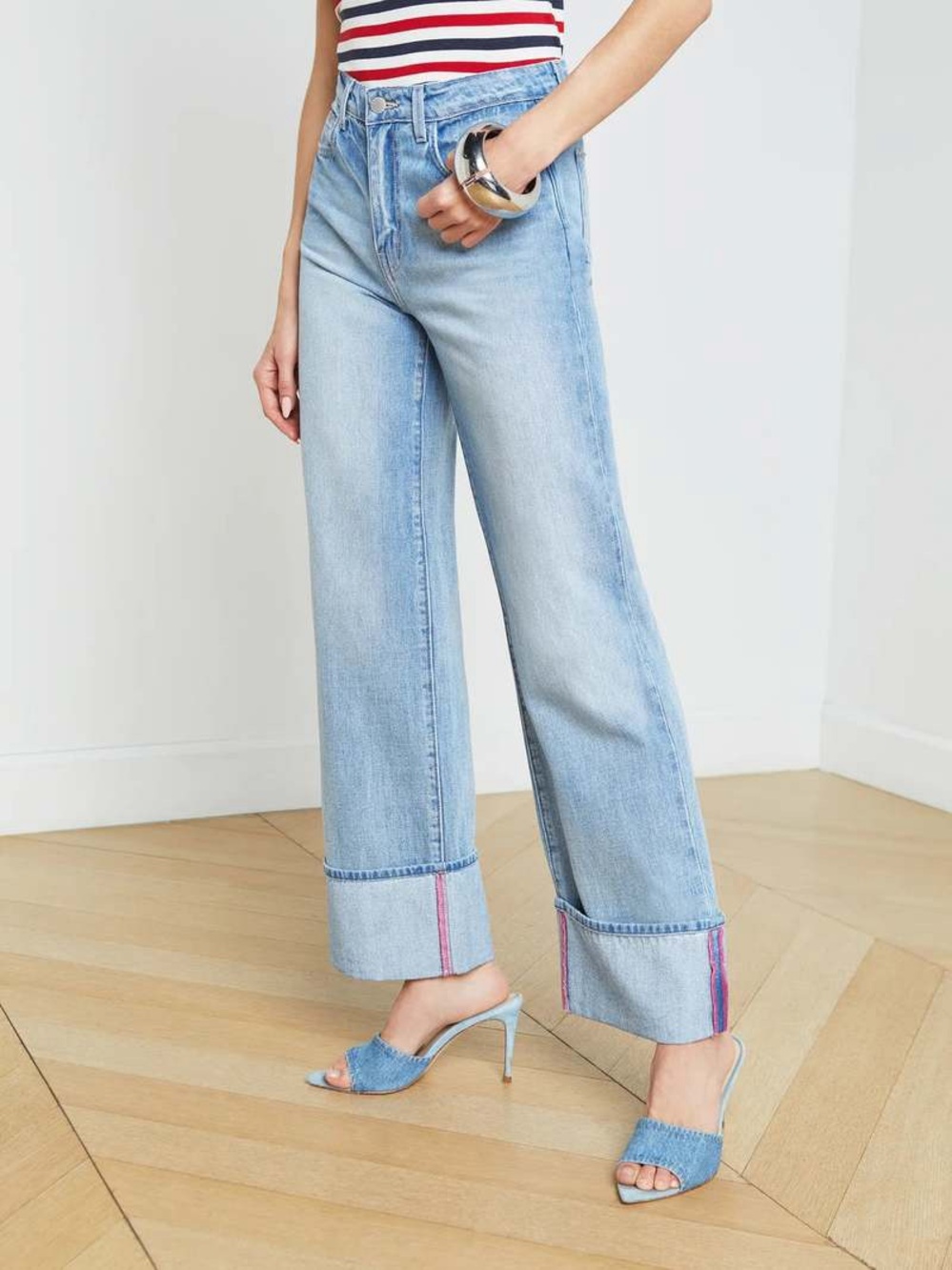 L'AGENCE Miley high-waist cuffed wide-leg jeans in a light blue denim wash.
